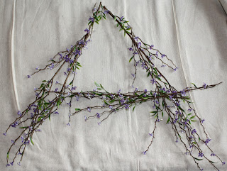 Purple flowers in the shape of an A