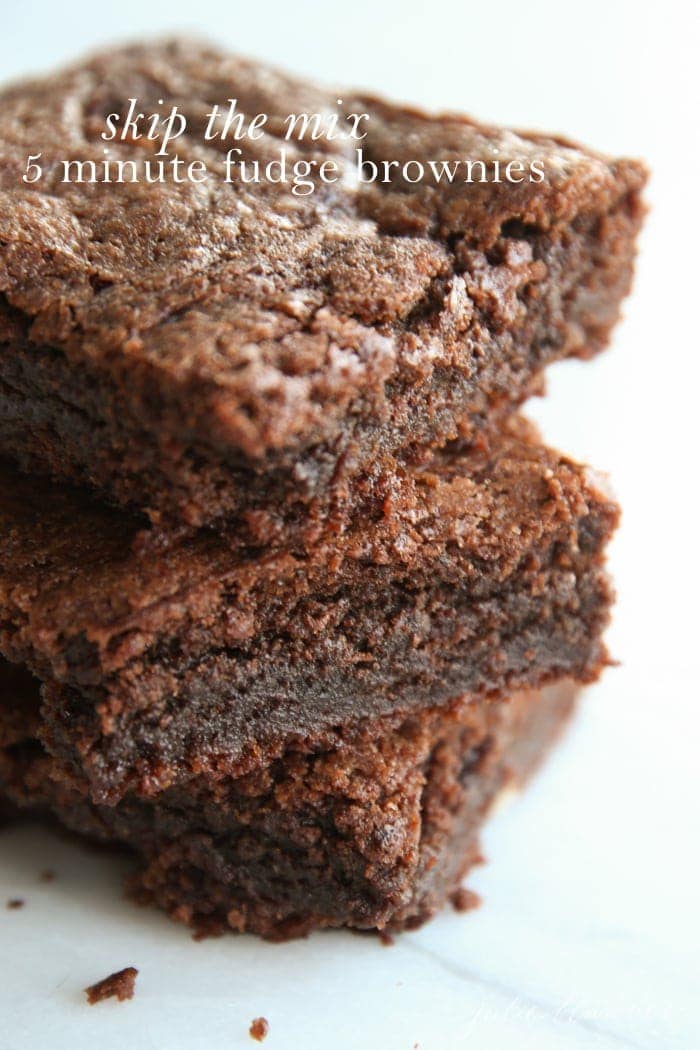 Homemade brownies, sliced into squares in a stack.