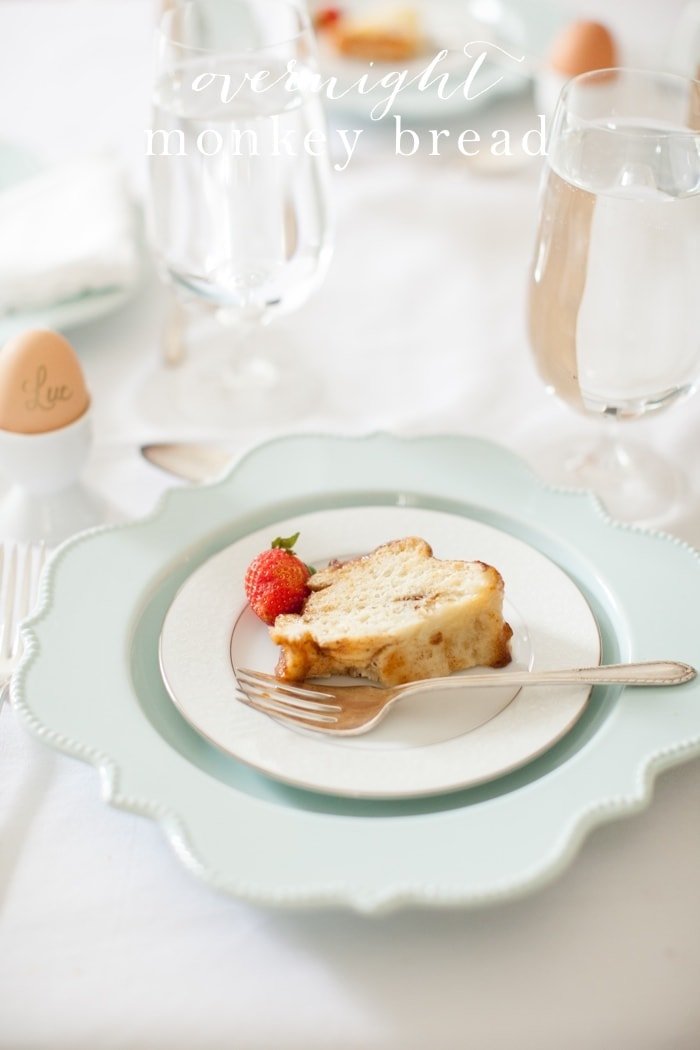 Overnight monkey bread on a plate with text overlay