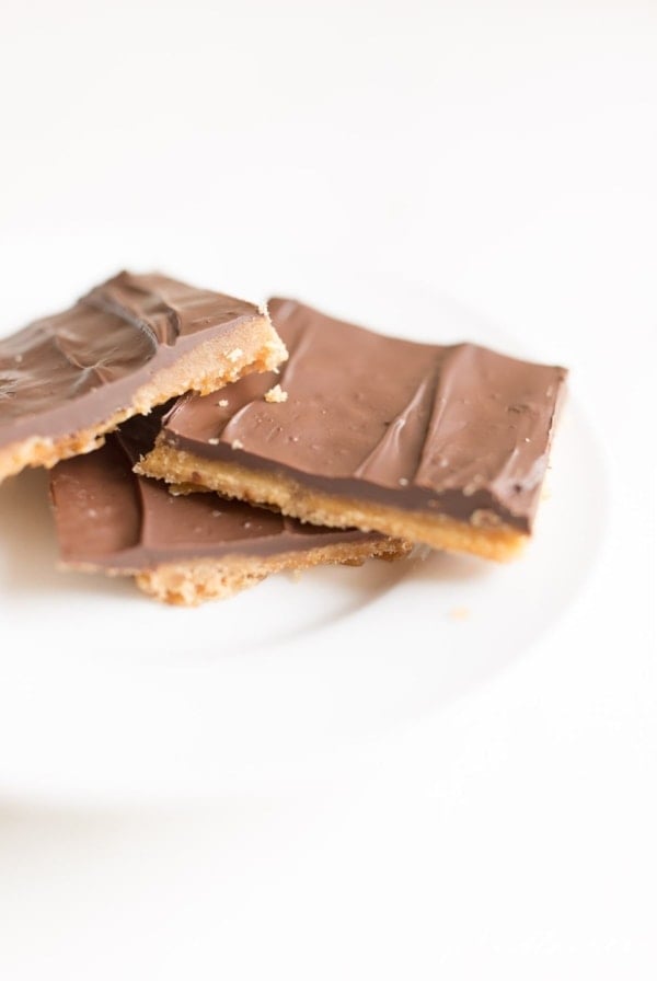Christmas crack saltine toffee on a white plate