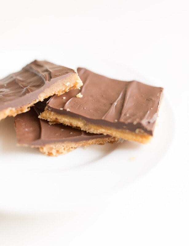 Christmas crack saltine toffee on a white plate