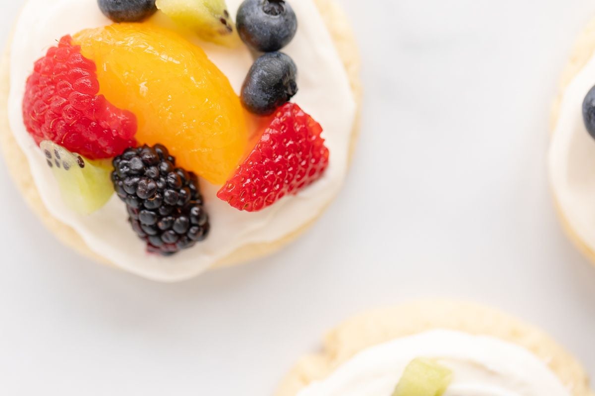 Fruit pizza cookies on a marble surface