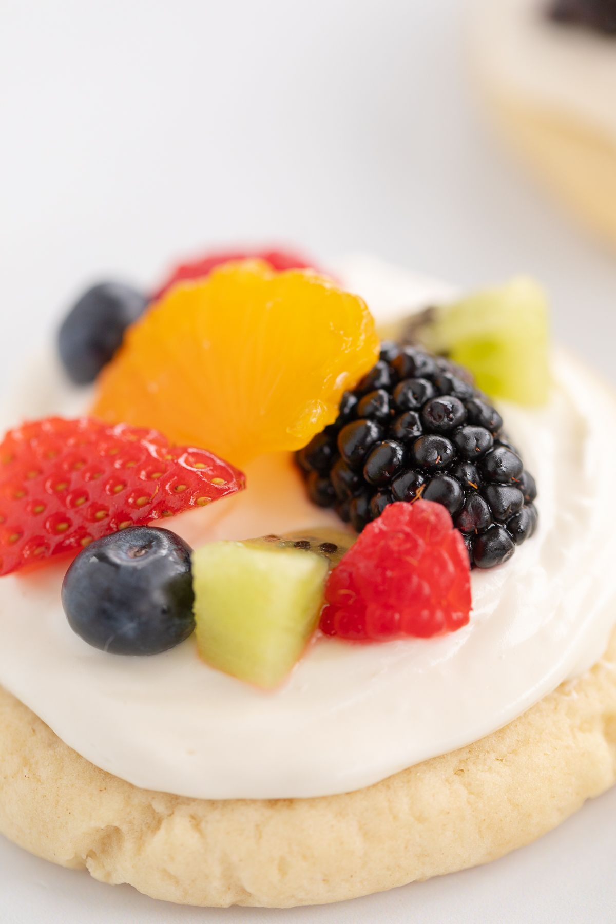 Fruit pizza cookies on a marble surface