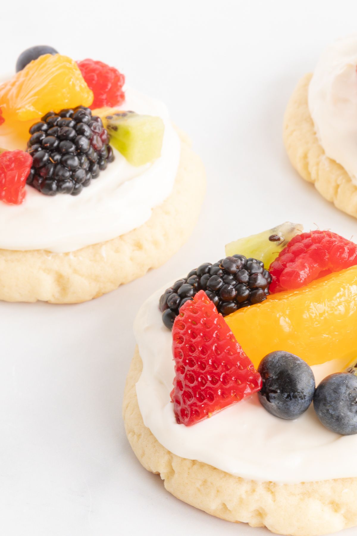 Fruit pizza cookies on a marble surface