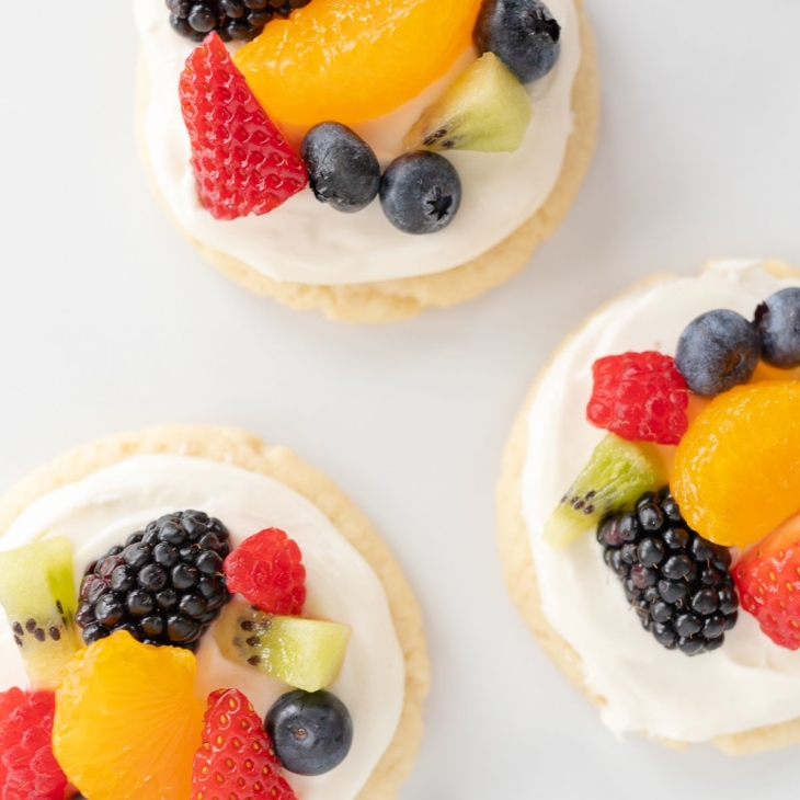 Fruit pizza cookies on a marble surface