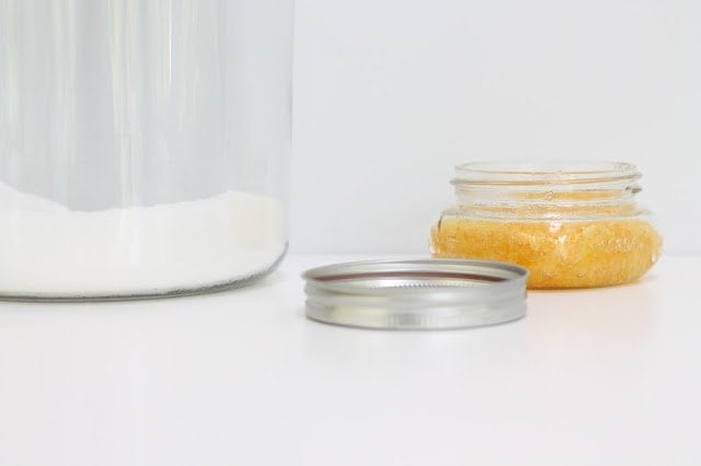 exfoliating body scrub in jar with lid