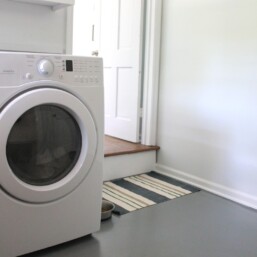 gray painted concrete floor in laundry room
