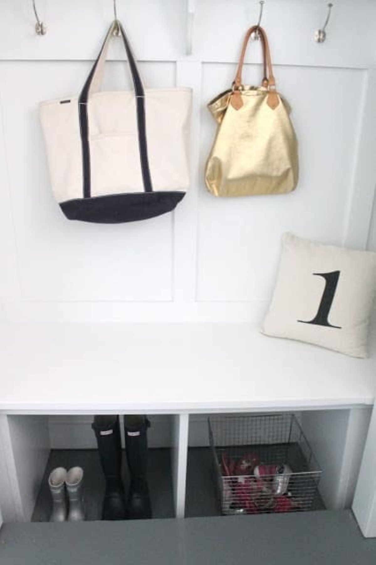 A closet converted to a mudroom bench and storage area