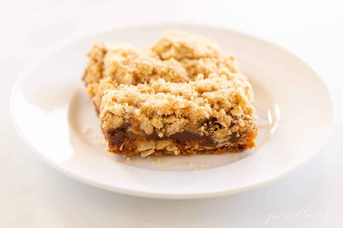 oatmeal bar with chocolate chips and caramel on white plate