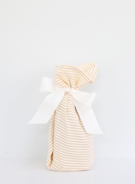 A wrapped gift with a white ribbon.