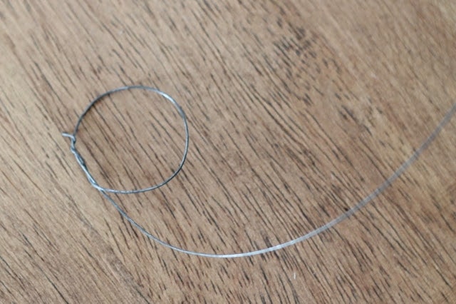 silver wire on a wood surface