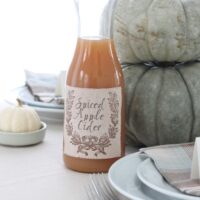 fabric label on apple cider carafe with table setting