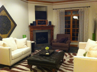 A living room filled with furniture and a fire place