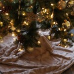 no sew faux fur tree skirt wrapped around the base of a beautifully decorated Christmas Tree