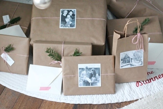 kraft paper christmas paper wrapping tied with baker's twine and decorated with old family photos.