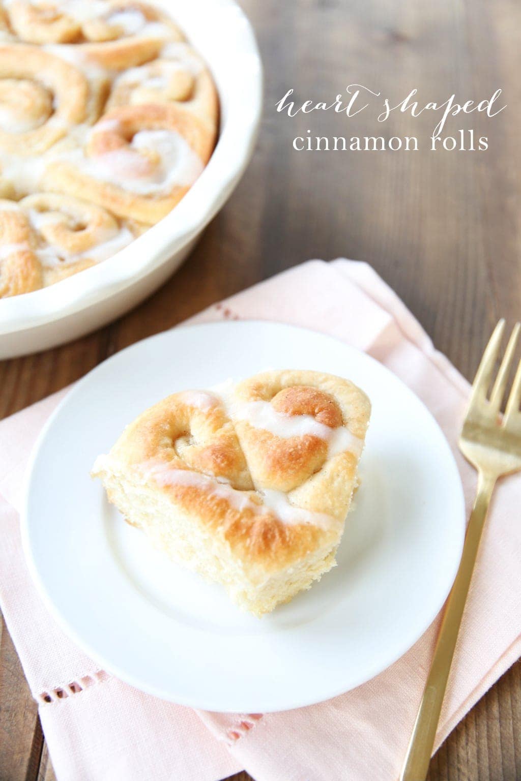 Thick bakery style cinnamon rolls in heart shapes for Valentine's Day!