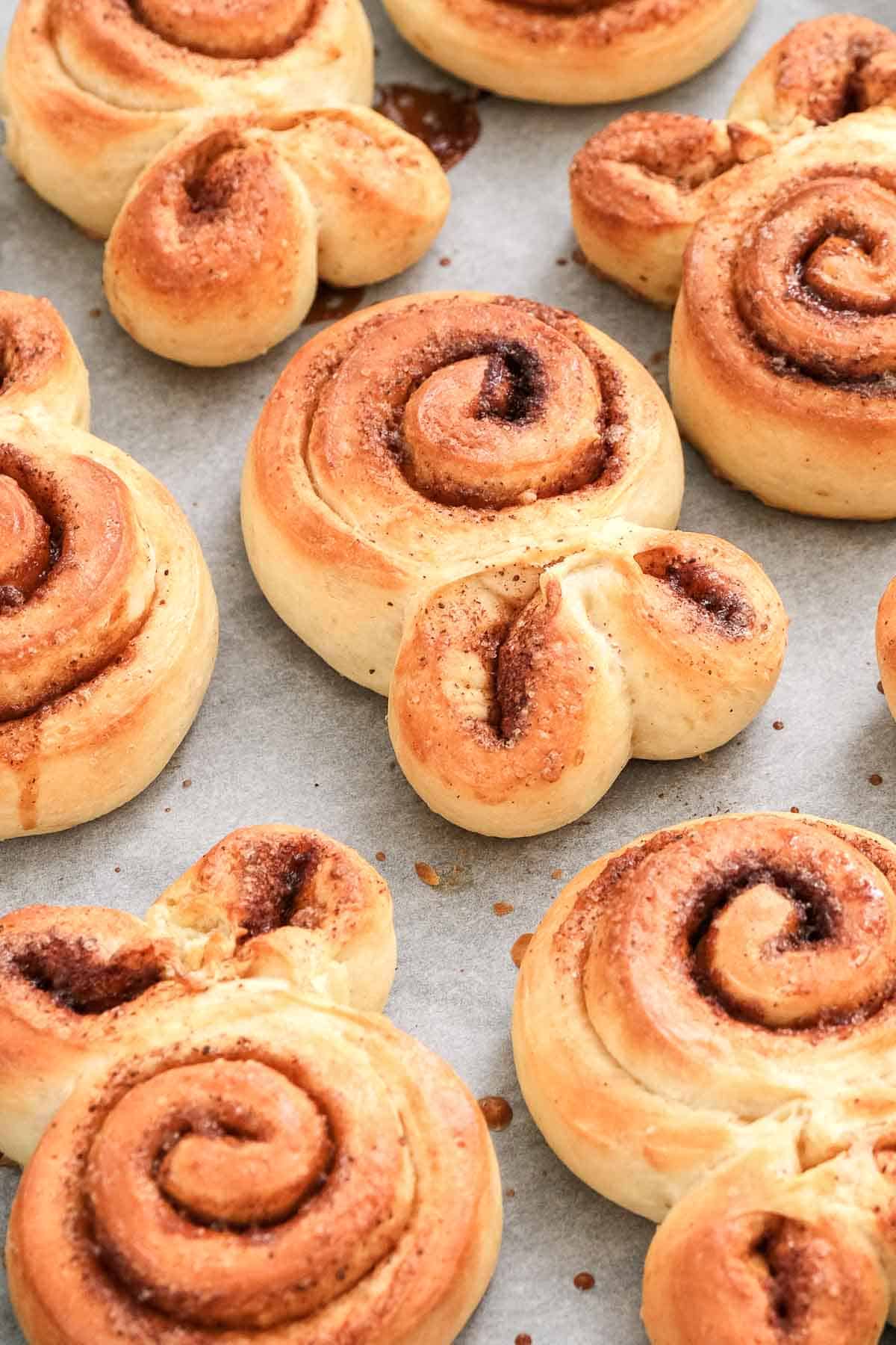 bunny shaped cinnamon rolls on baking sheet