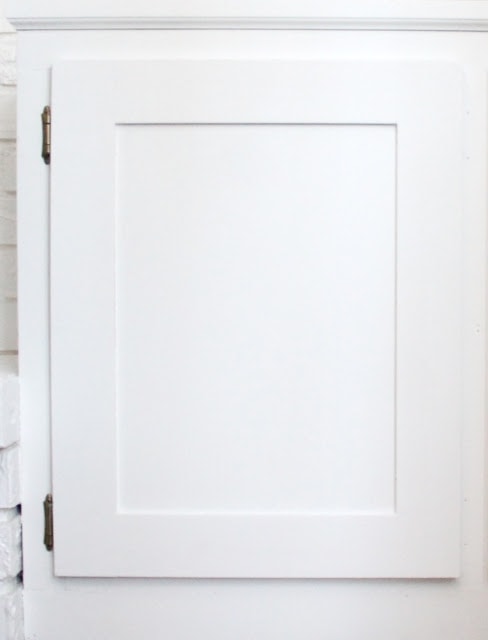 A close up of a white bookcase