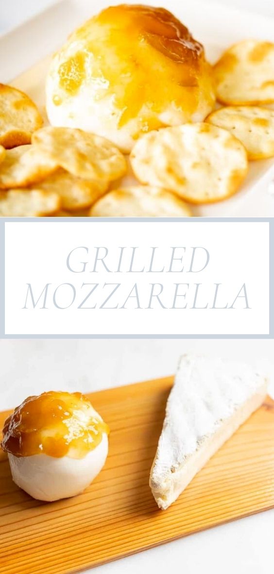 On a wooden plank, there is a piece of grilled mozzarella, a slice of cheese, and crackers.