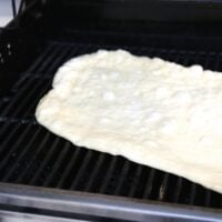 pizza dough on grill