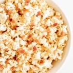 A white bowl filled with bacon popcorn