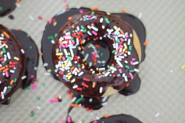 Overhead shot of an iced donut topped with sprinkles