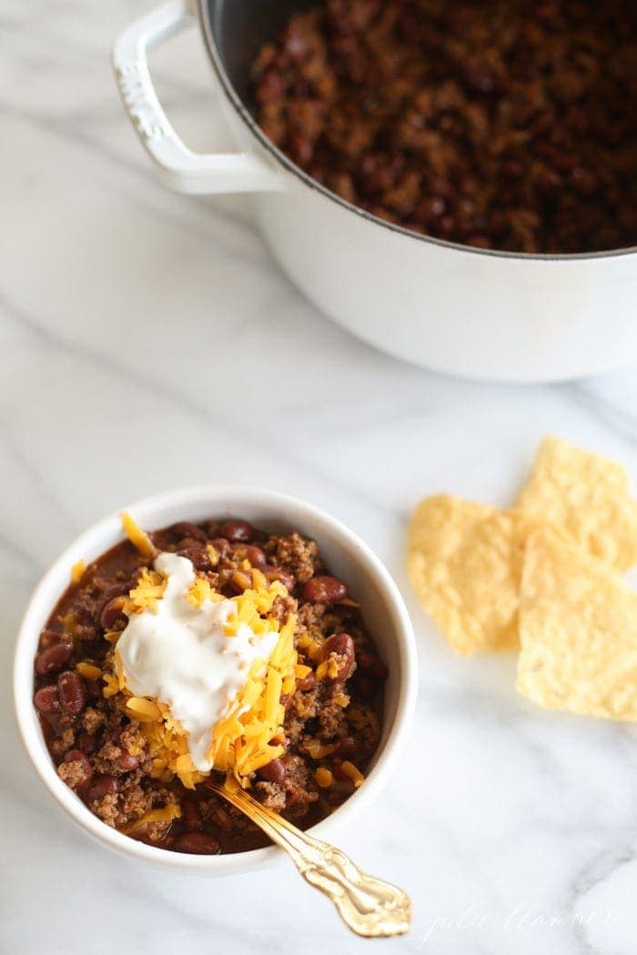 Quick chili in a bowl with cheese and sour cream
