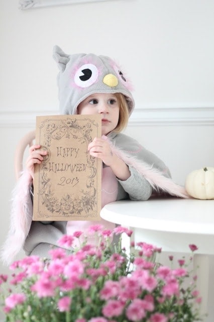 A little girl holding a printable 