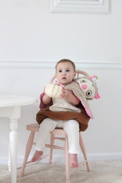 A baby sitting in a chair