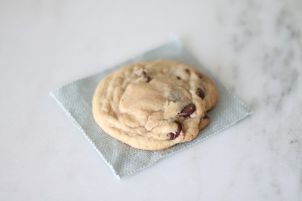 A salted caramel chocolate chip cookie on a placemat