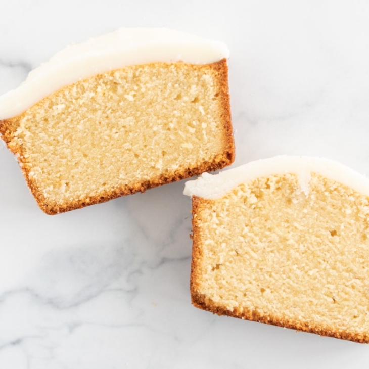 Two slices of pound cake covered in an easy pound cake glaze recipe.