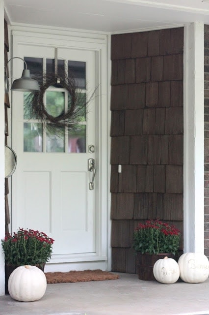 Fall front door wreath on a white door