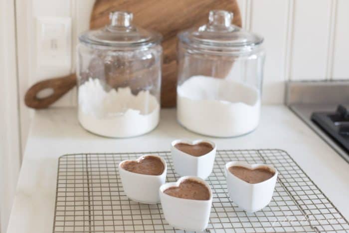 pots de creme in front of jars of sugar and flour
