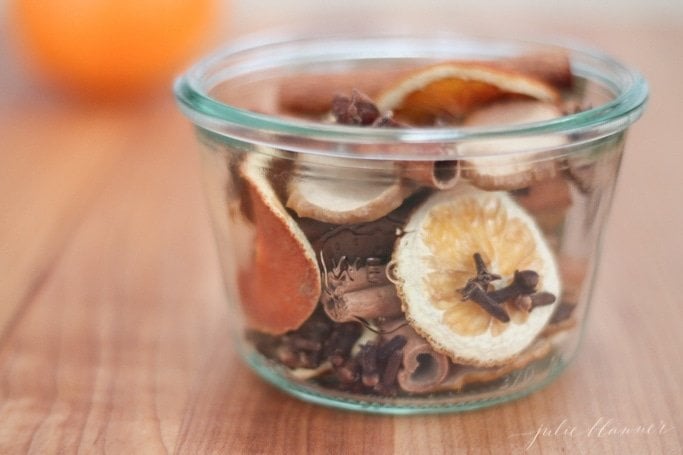 homemade potpourri recipe with oranges in glass jar
