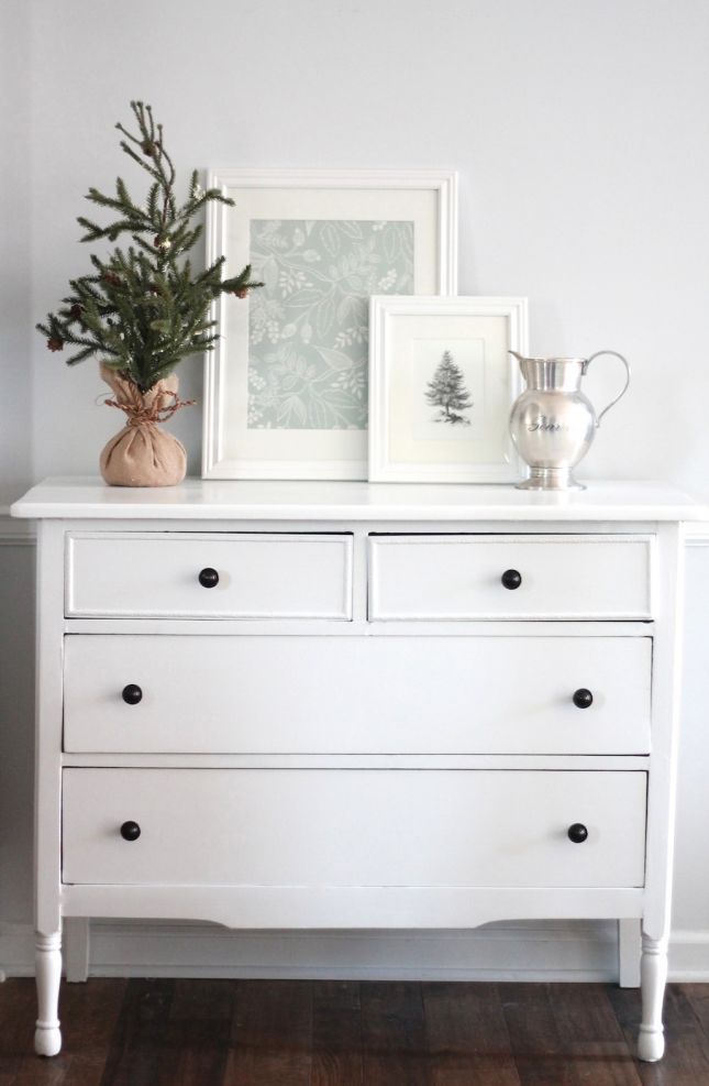 simple winter decor of a printable framed photo on a white dresser.