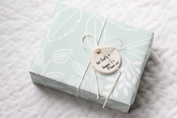 pretty Christmas gift wrap in blue and white with a salt dough ornament label
