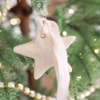 salt dough ornament on tree with pink ribbon