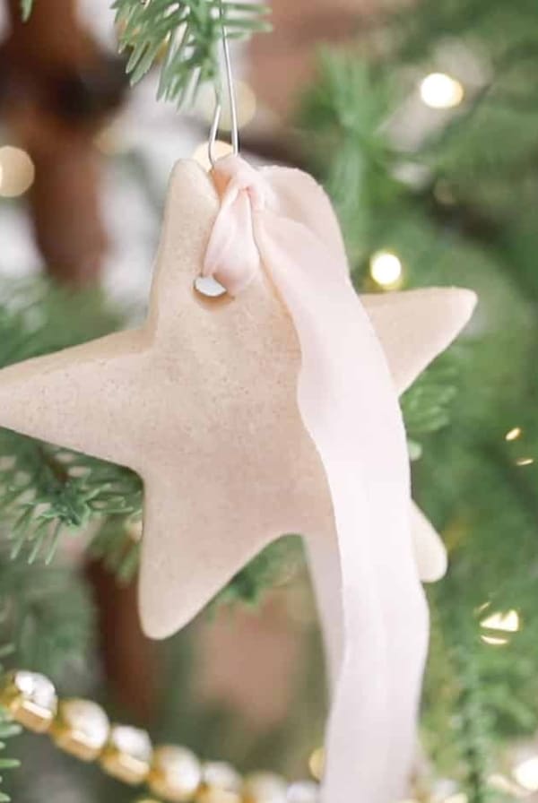salt dough ornament on tree with pink ribbon