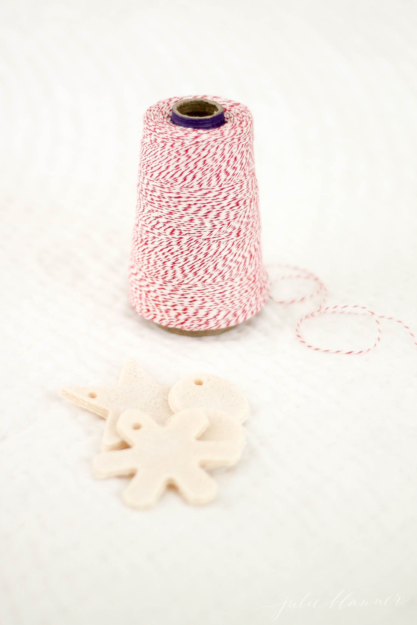 salt dough gift tags in a pile next to twine