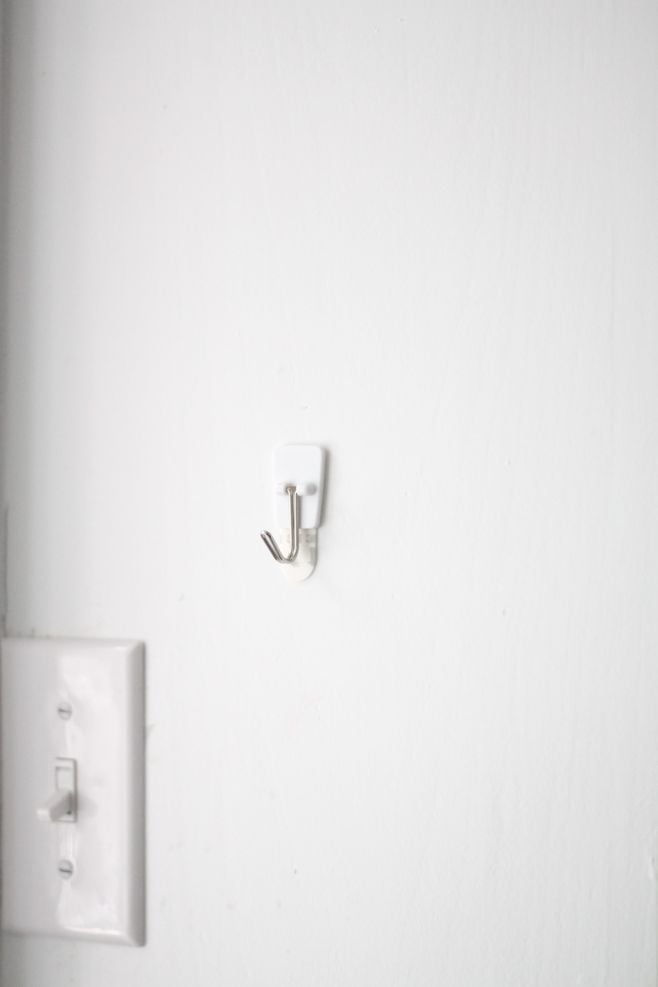 command hook hanging on cabinet