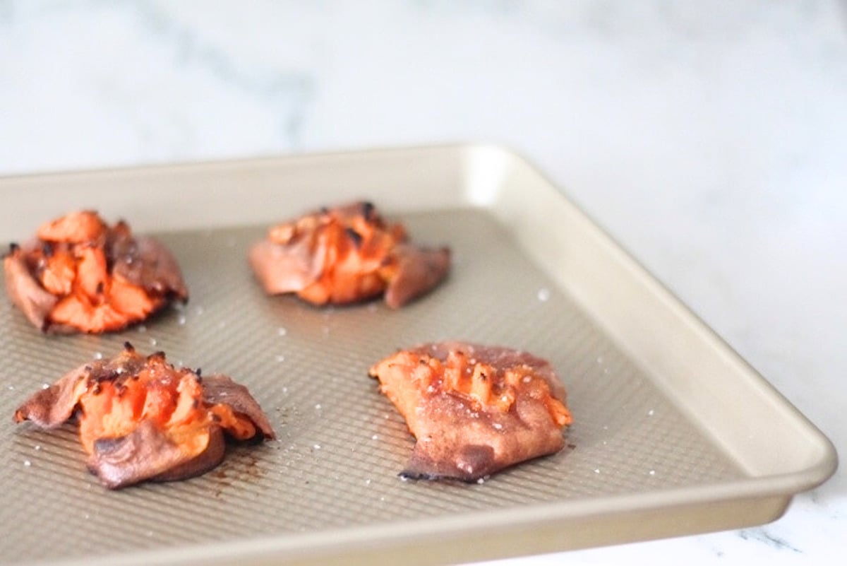 Smashed sweet potato truffles on a baking sheet.