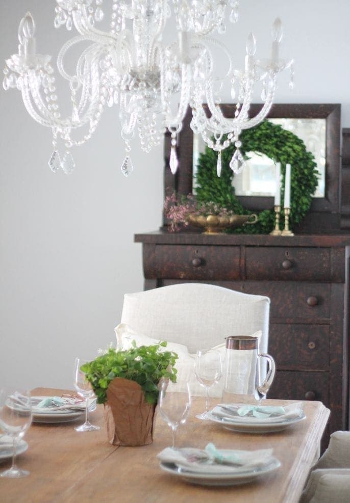 A set table with various greenery throughout. 