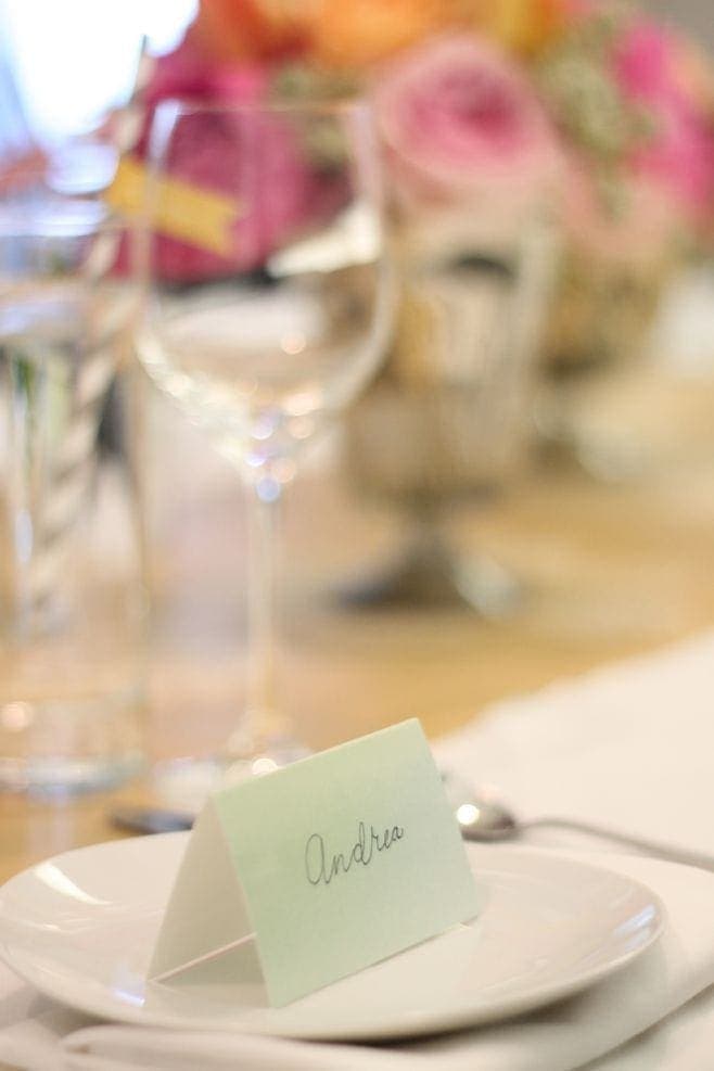 A fake calligraphy name tag on top of a white plate.