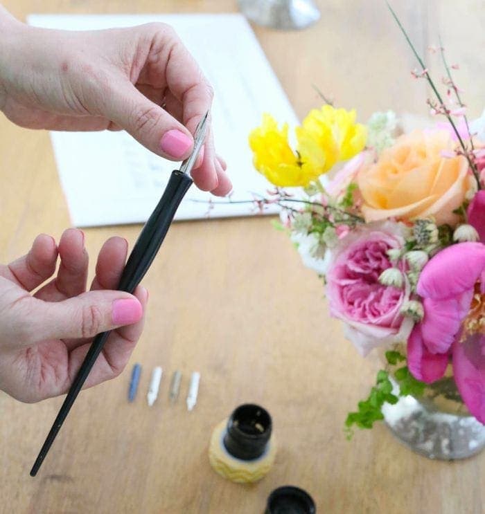 A calligraphy pen being assembled. 