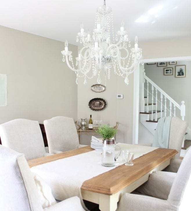 A neutral living room painted in Accessible Beige, a greige paint color