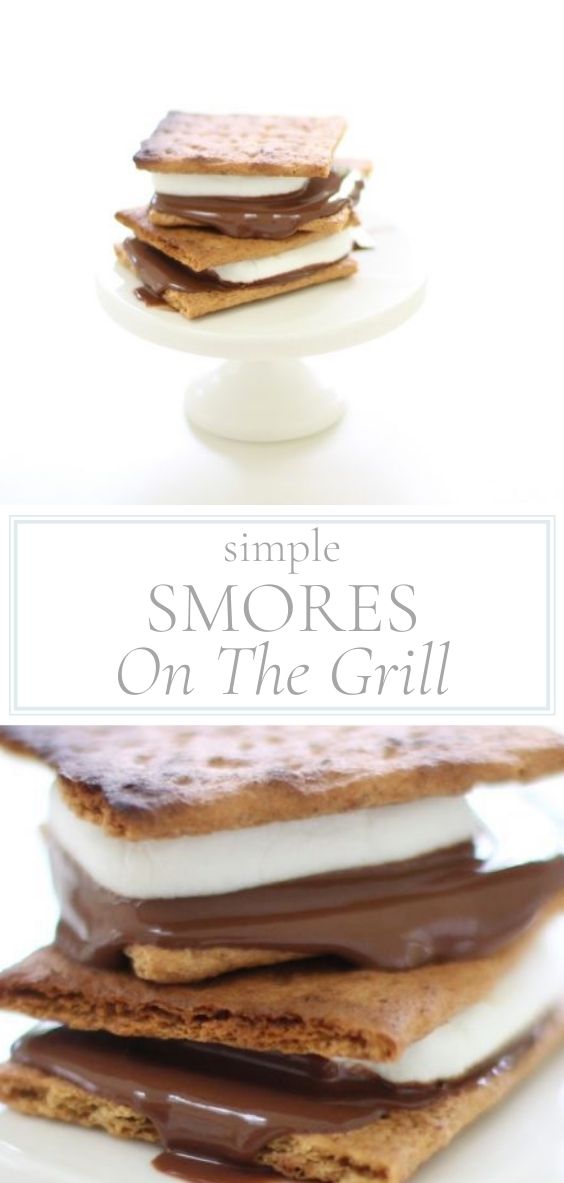 On a marble counter top, there is a white stand holding a SMORE made on a grill.