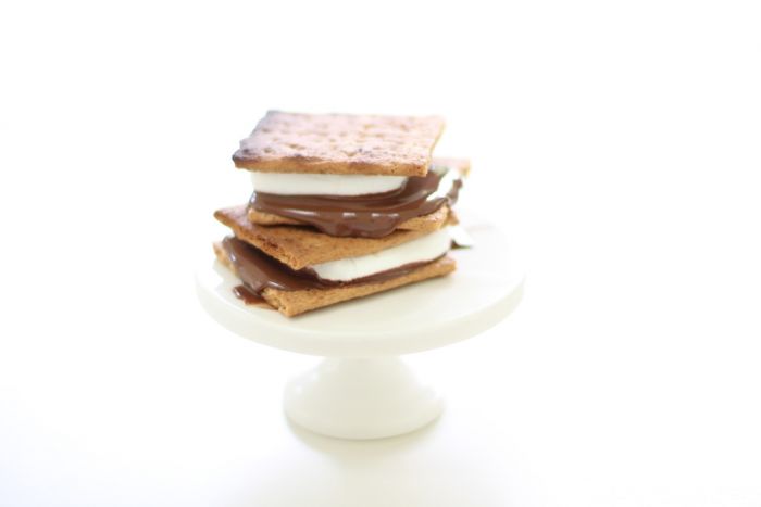S'mores stacked on a white cake stand