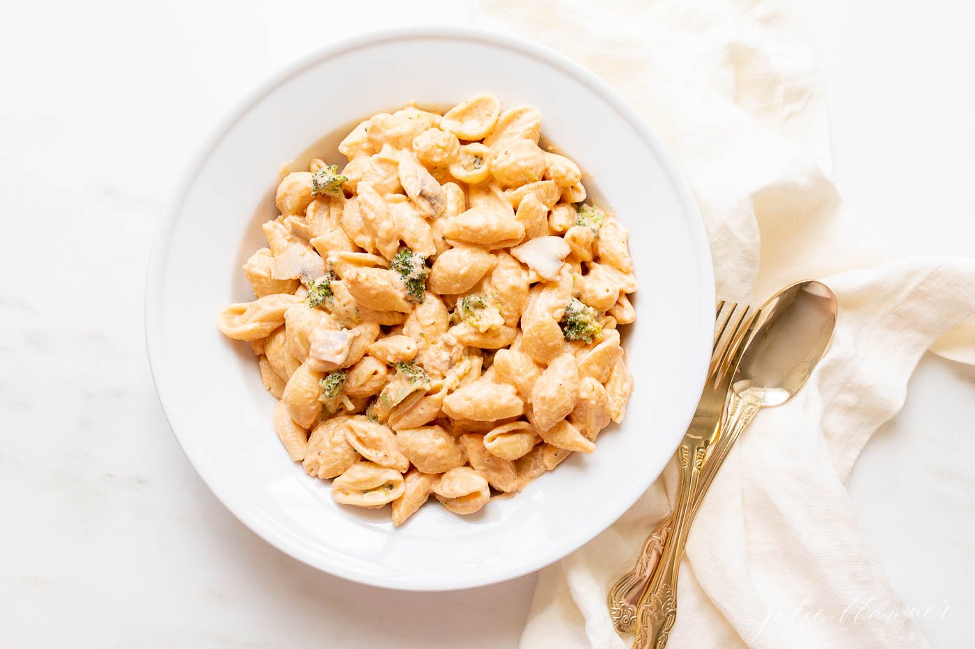 pasta in a bowl with a fork and spoon