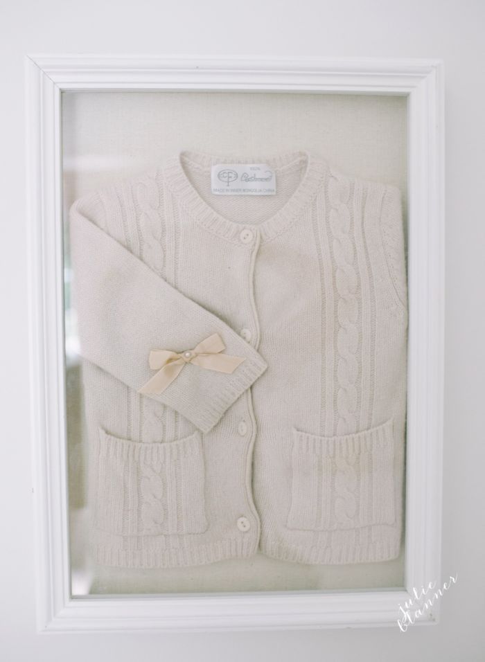 A framed cardigan sweater in a girly pink bedroom makeover