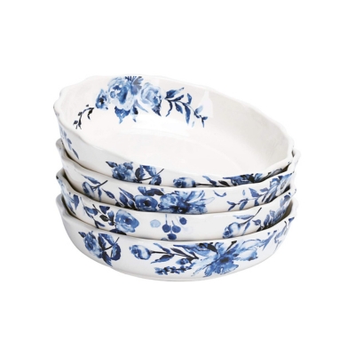 A stack of four blue and white floral bowls.